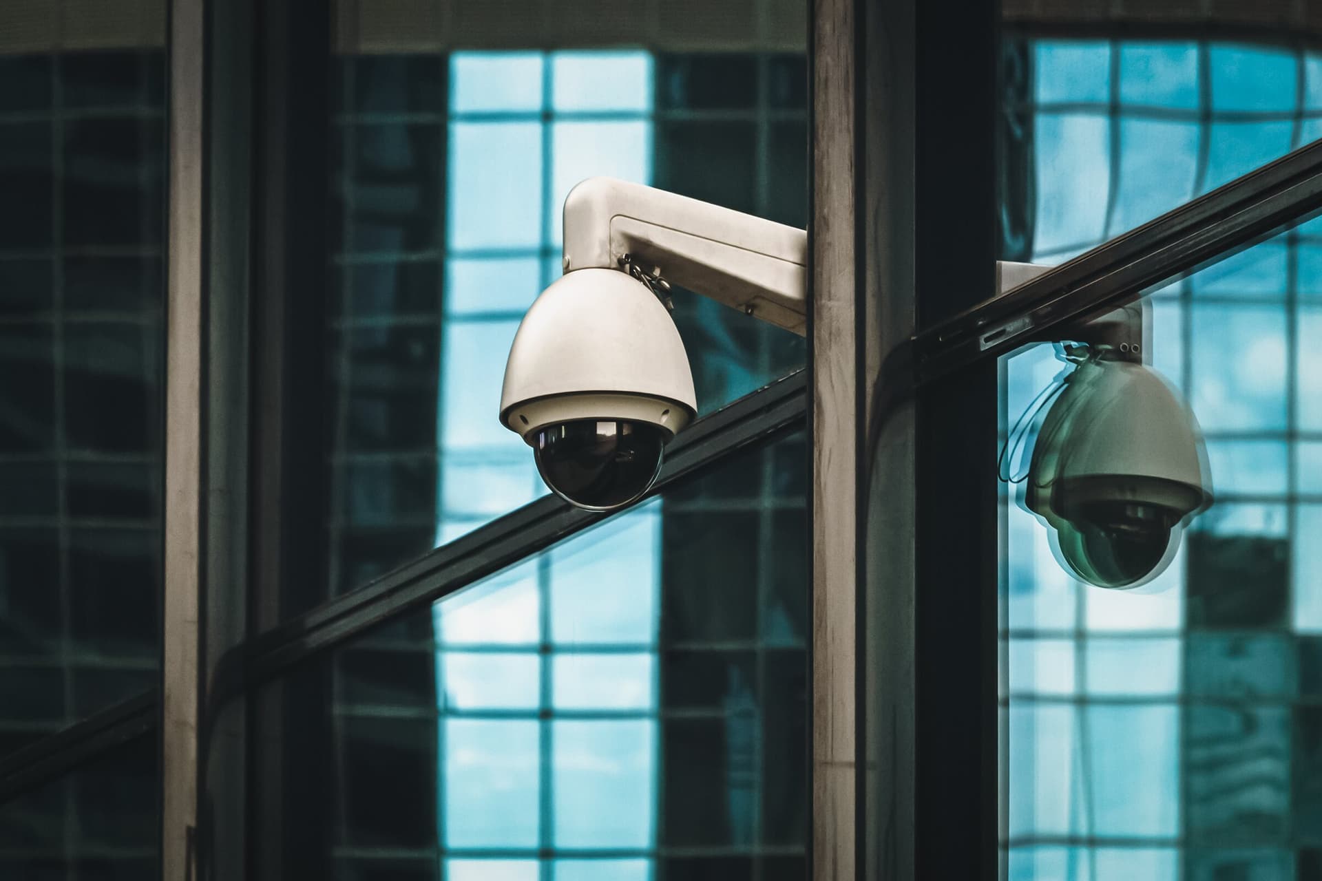 Dome security cameras mounted on the exterior of a building